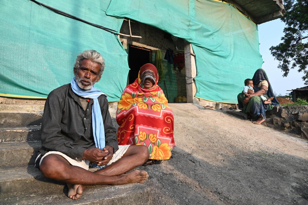 Manju Devi, who lost her 3-day-old daughter days after being bitten by rats in the NICU of Indore’s MY Hospital, sits with her father Harichand Meda outside his house in Nandana village in Madhya Pradesh’s Dhar district. 