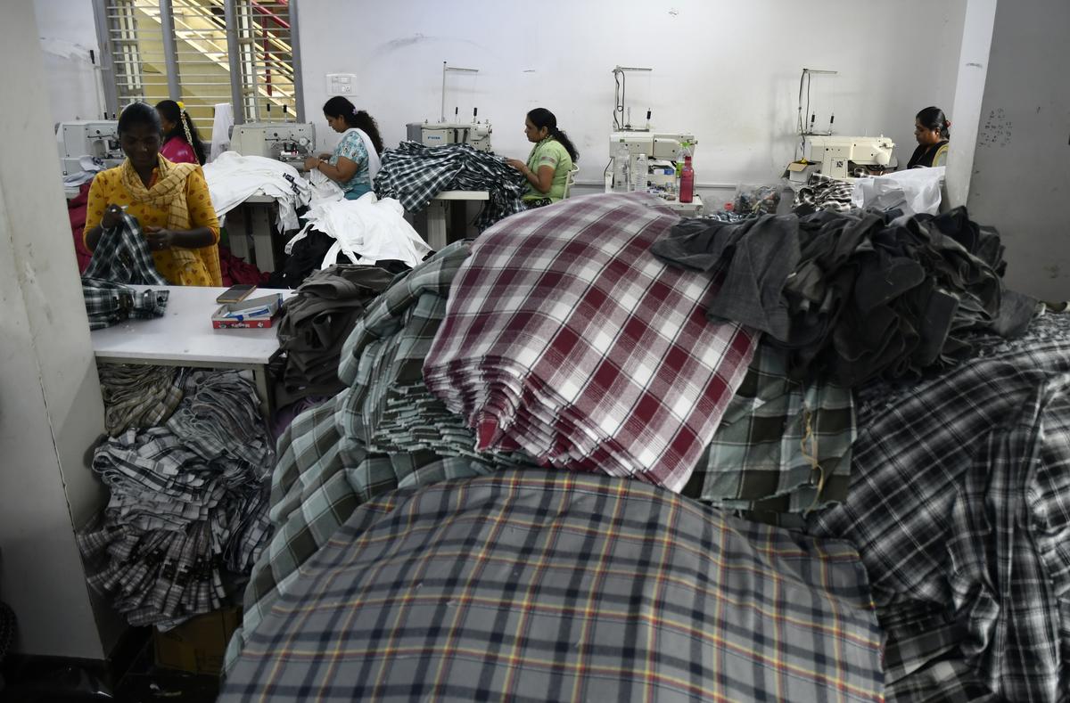 Garment worker tailors clothes at an apparel manufacturing unit in Bengaluru.