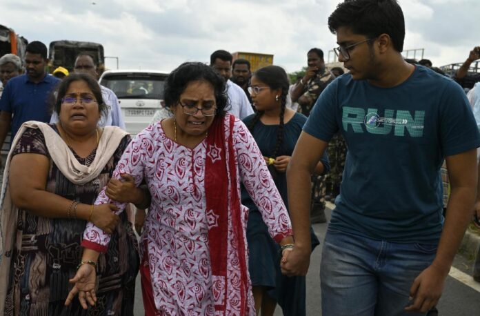 Family members grieve the death of a loved one in the accident.