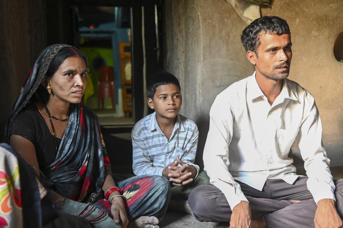 Prabhu Dayal Yaduvanshi and Kunti Yaduvanshi sit with their elder son Jitendra at their home in Dighavani village in Madhya Pradesh’s Chhindwara. Their younger son, Vikas, died after having Coldrif.