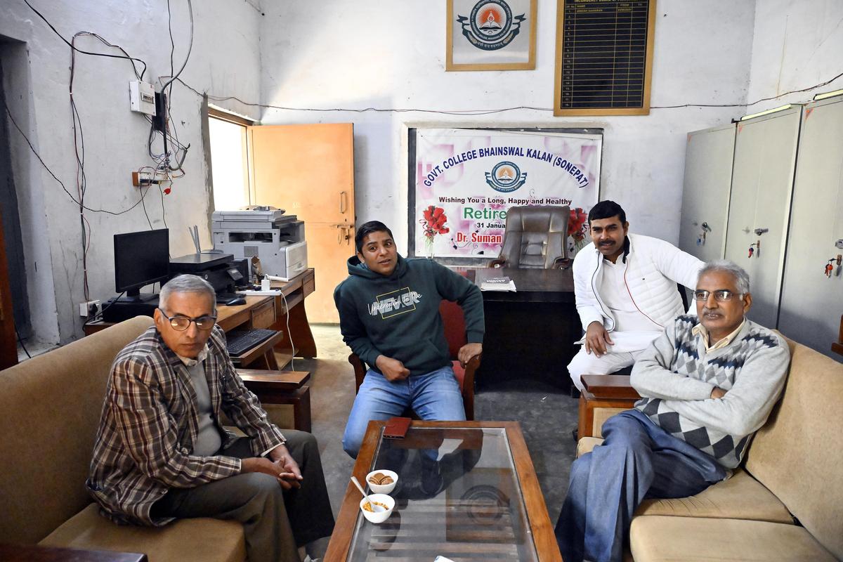 In the Bhainswal Kalan Government College staff room (left to right): Government Senior Secondary School principal Rajender Malik, assistant professor (Political Science) Ashwani Kumar, assistant professor (Computer Science) Manjit Singh, principal Suraj Prakash Yadav. In the Bhainswal Kalan Government College staff room (left to right): Government Senior Secondary School principal Rajender Malik, assistant professor (Political Science) Ashwani Kumar, assistant professor (Computer Science) Manjit Singh, principal Suraj Prakash Yadav.