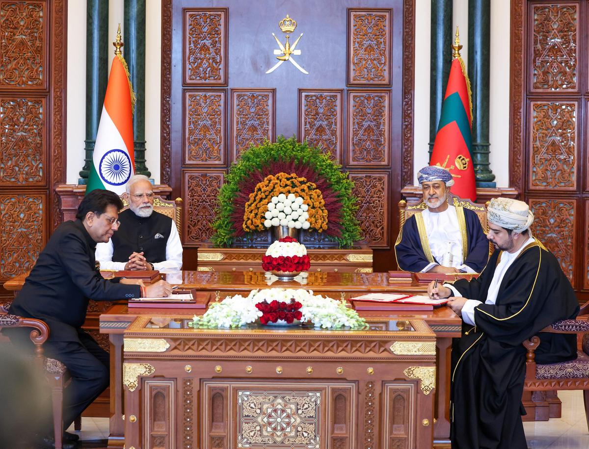 Mr. Modi and Sultan of Oman Haitham bin Tarik witness the signing of MoUs by Union Minister of Commerce and Industry Piyush Goyal and Oman’s Minister of Commerce, Industry and Investment Promotion Qais bin Mohammed Al Yousef, in Muscat on December 18, 2025. Mr. Modi and Sultan of Oman Haitham bin Tarik witness the signing of MoUs by Union Minister of Commerce and Industry Piyush Goyal and Oman’s Minister of Commerce, Industry and Investment Promotion Qais bin Mohammed Al Yousef, in Muscat on December 18, 2025.