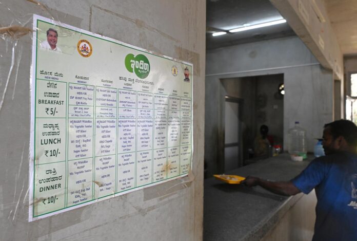 A man collects a meal at the Indira Canteen near Tannery Road, in Bengaluru on February 10, 2026. 